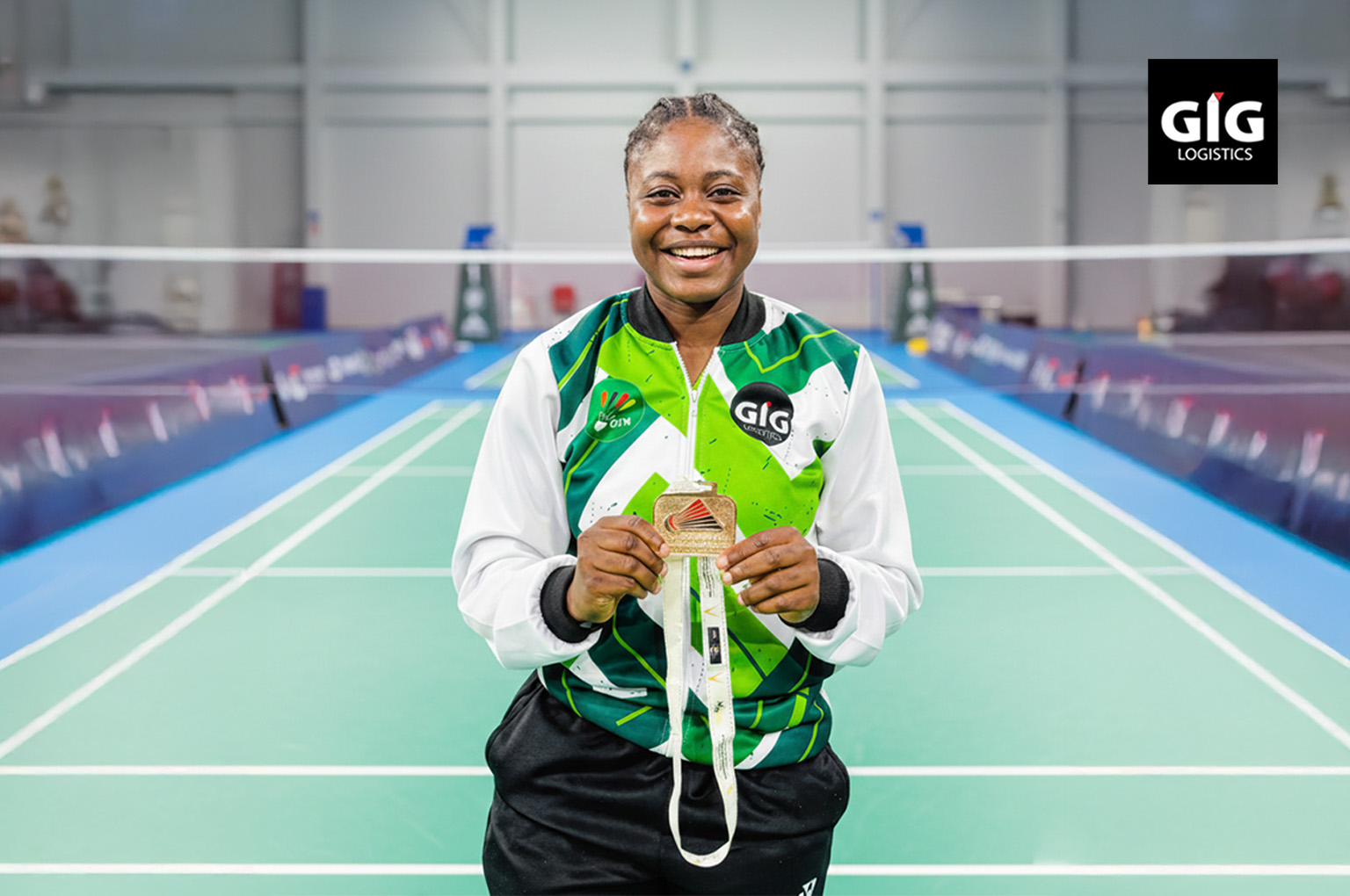 When Nigerian Excellence Goes Global: Eniola, Paralympics badminton champion holding her gold medal.